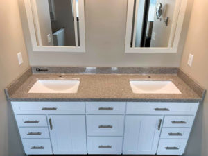 Double vanity sink with middle cabinet